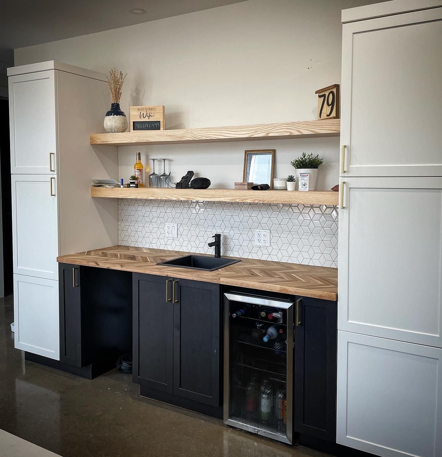 Kitchenette with geometric mosaic backsplash and butcher-block counter